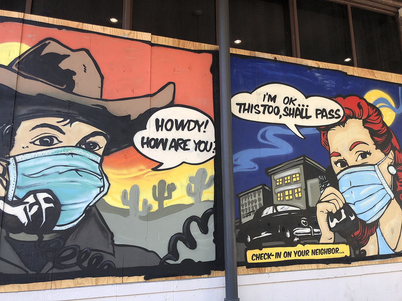 Mural in Austin depicting a cowboy and nurse with facemasks
