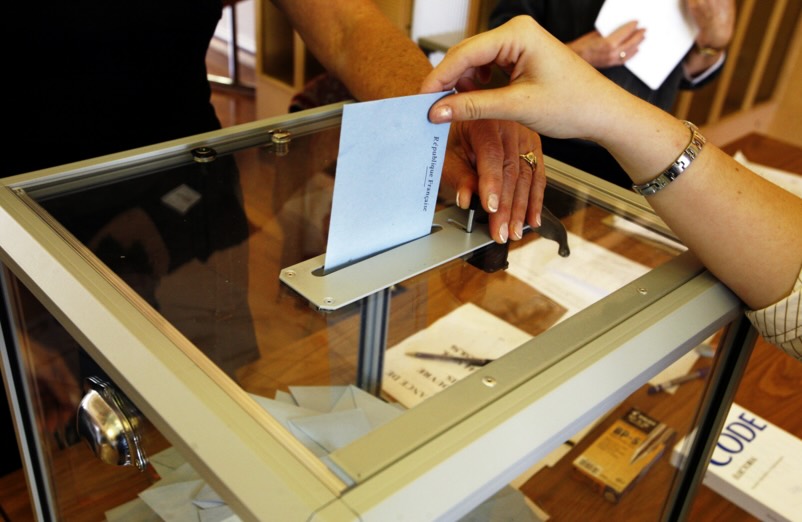 Voting booth with person voting