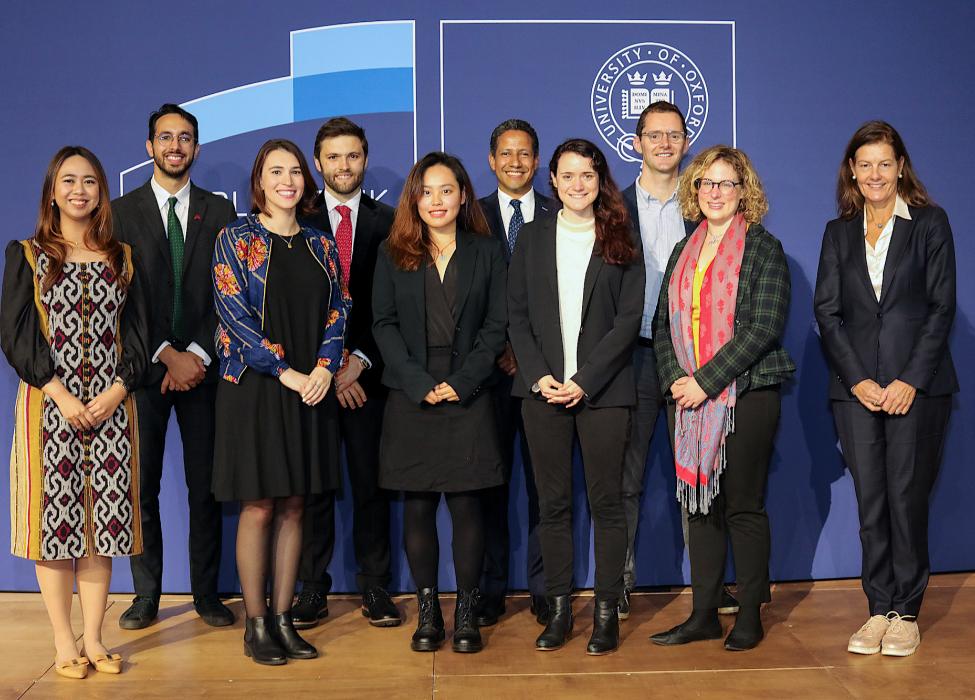 Eight of the DPhil students starting in 2021 with Ngaire Woods and Julien Labonne